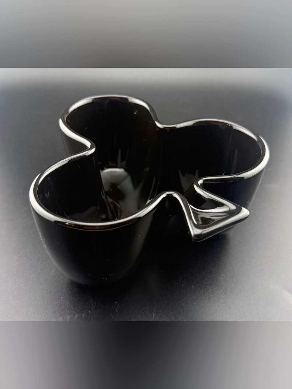 Sur La Table club-shaped, black ceramic snack bowl.